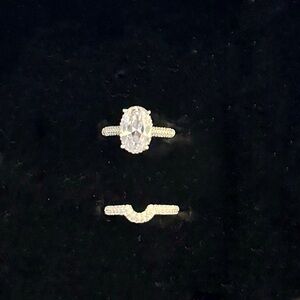 Sterling silver oval solitaire set with hidden halo and pavé bands, size 6